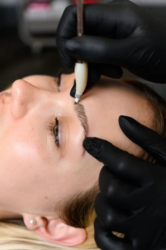 Woman receiving microblading 