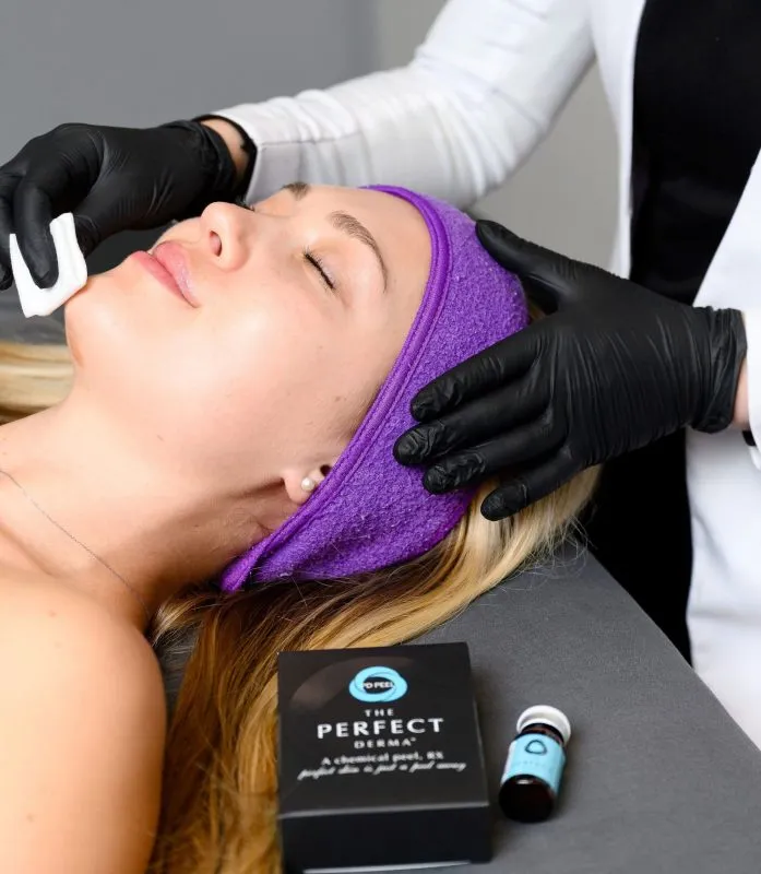 Woman receiving a chemical peel
